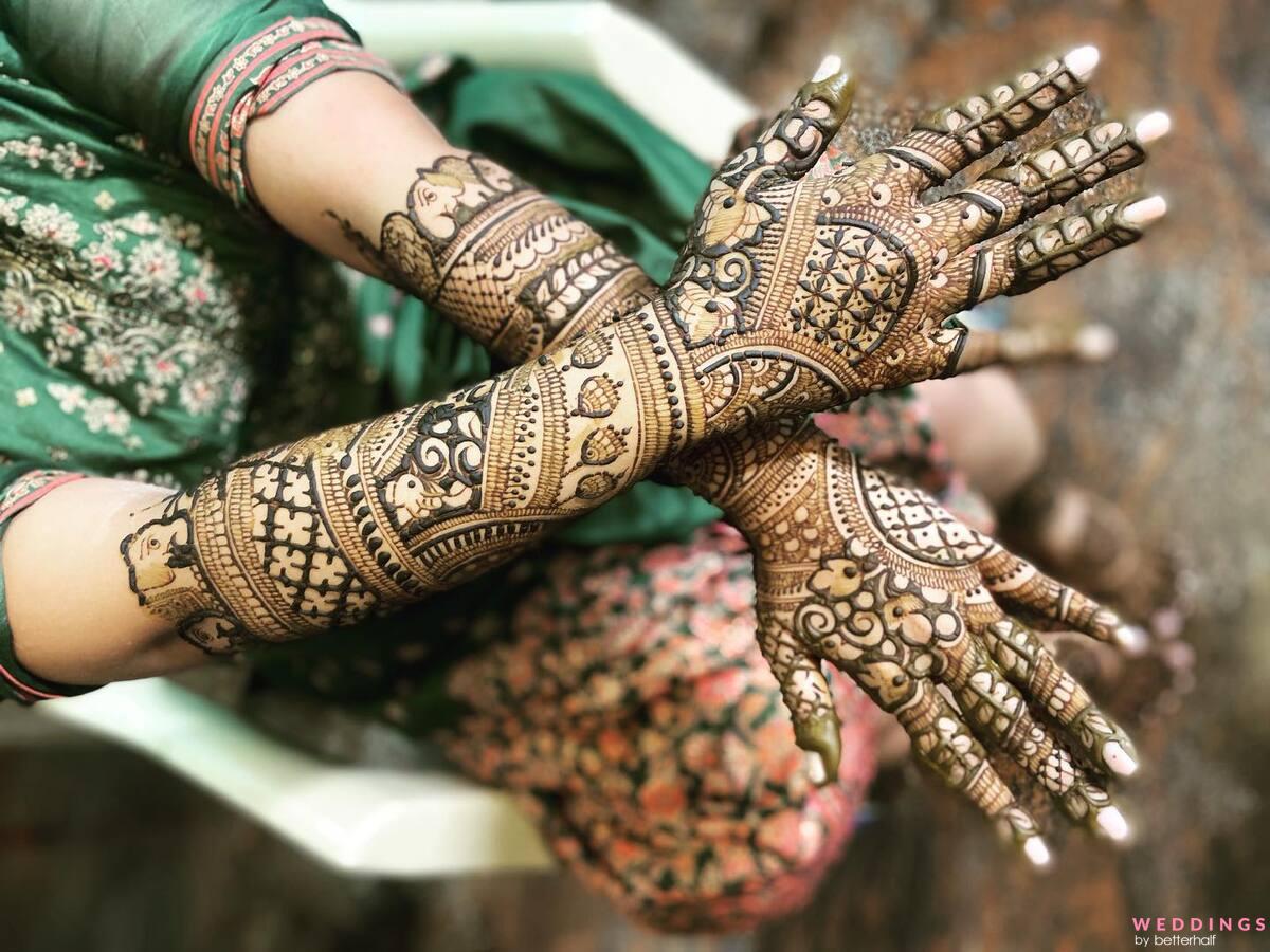 Photo of Intricate traditional back hand mehndi design.