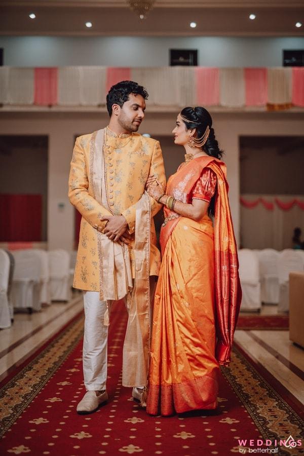 Free Photos - A Man And A Woman, Possibly An Indian Couple, Dressed In  Traditional Attire. The Man Is Wearing A Yellow And Orange Outfit, While  The Woman Is Adorned With A