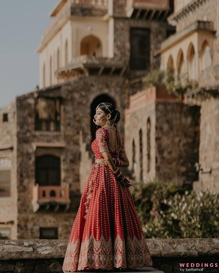 Interfaith Bride and Groom in Red and Gold Lehenga and Kurta