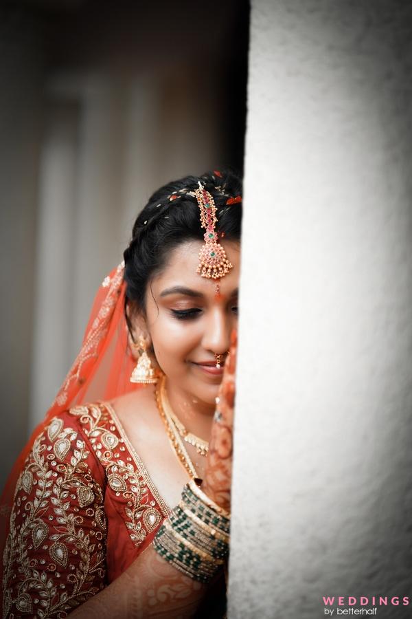 Indian bride posing for pictures wearing the bridal ruby saree. | Photo  259364