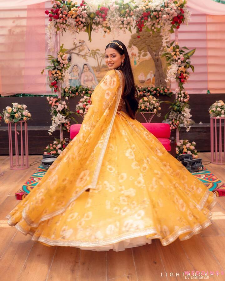 Photo of floral lehenga in yellow and pink
