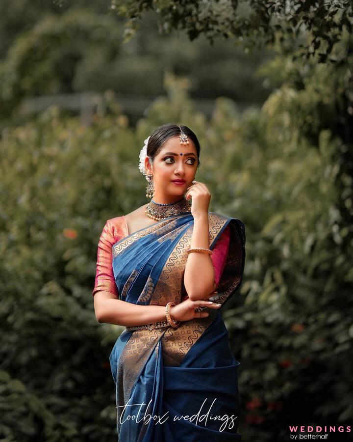 Stunning Young Indian Woman Donning Traditional Saree Elegantly Poses In  Scenic Outdoor Setting Photo Background And Picture For Free Download -  Pngtree