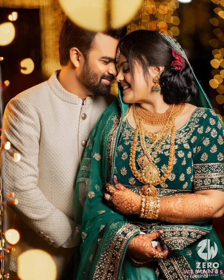 Groom holding bride hand with bangles and mehndi in Indian wedding  photography with selective focus Stock Photo - Alamy