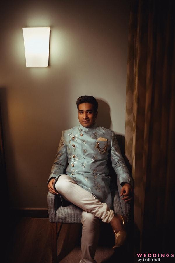 Photo of Unique groom look with blue sherwani and gold accessories