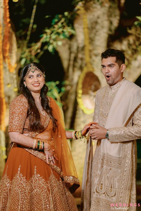 Photo of Candid shot of a happy couple from their Mehndi