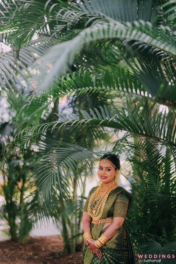 Woman influencer in stylish trendy clothes poses full-length against a  backdrop of bamboo trees, lifestyle blogger spring Stock Photo - Alamy
