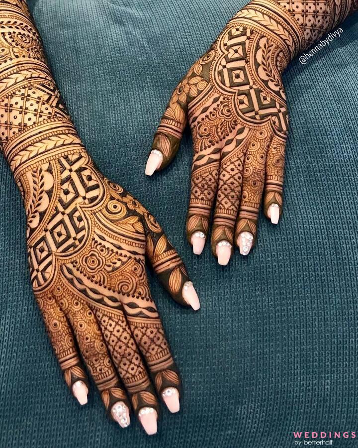 Photo of Intricate traditional back hand mehndi design.