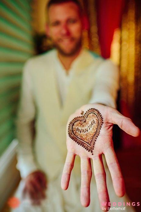 Indian wedding ceremony : groom hand with mehandi design Stock Photo |  Adobe Stock