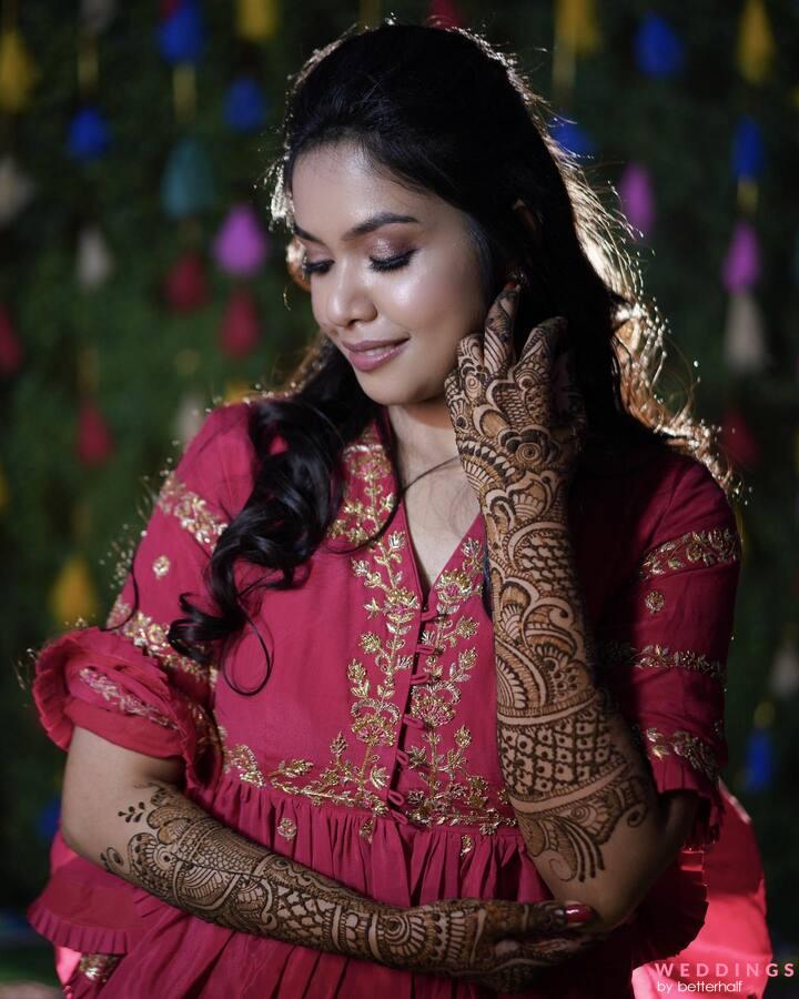 A Woman Wearing Lots of Accessories with Mehndi on Her Hand while Posing at  the Camera · Free Stock Photo