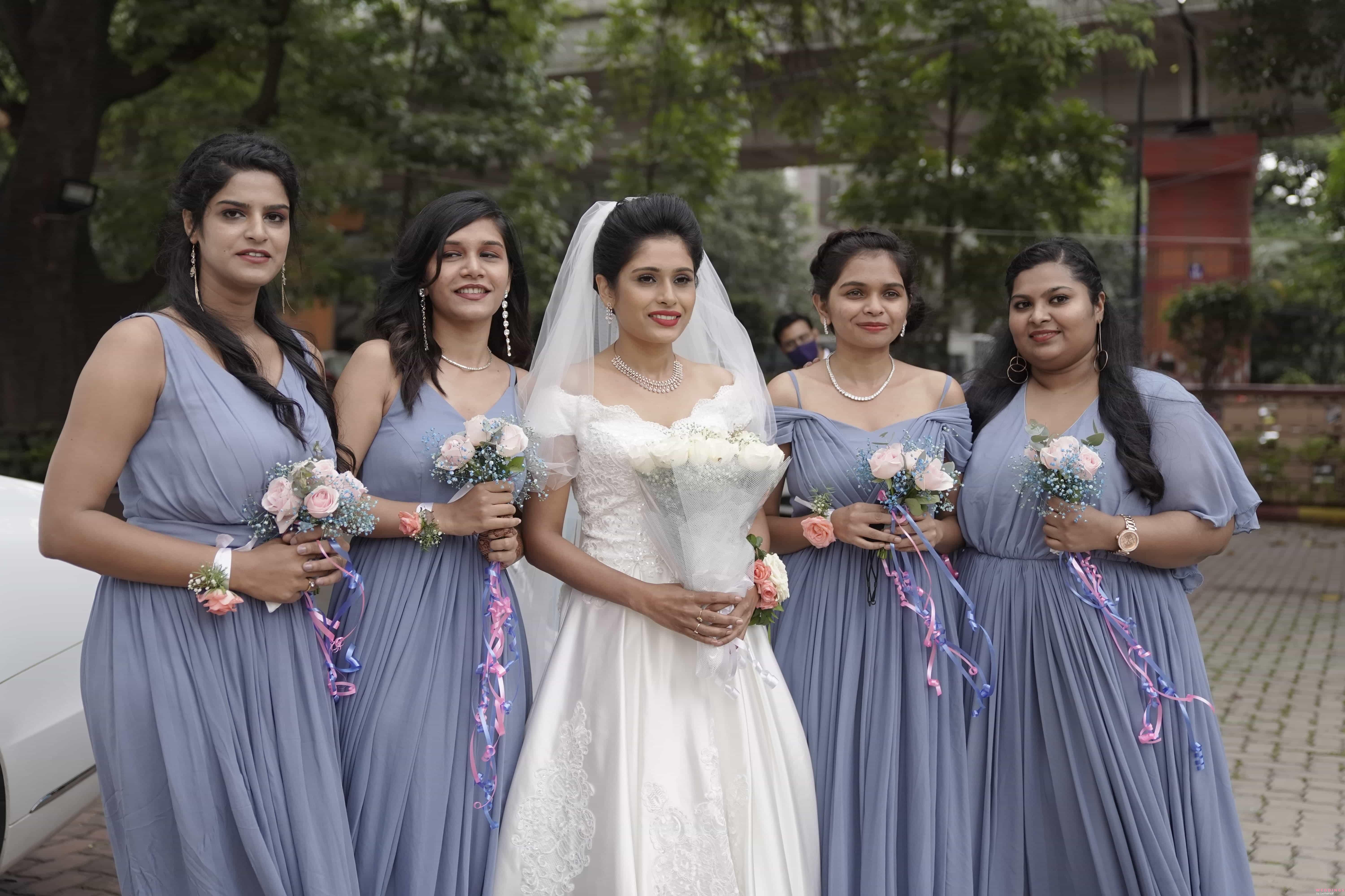A bride poses with her bridesmaid moments after getting married Stock Photo  - Alamy
