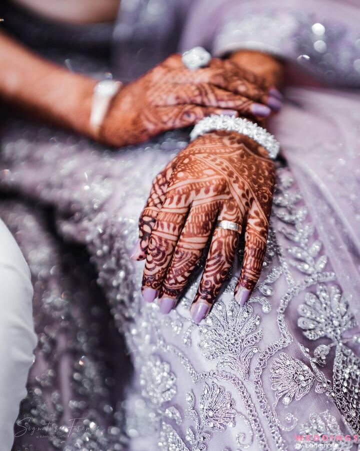 Indian bride to show mehendi design in her hands by the groom Stock Photo -  Alamy