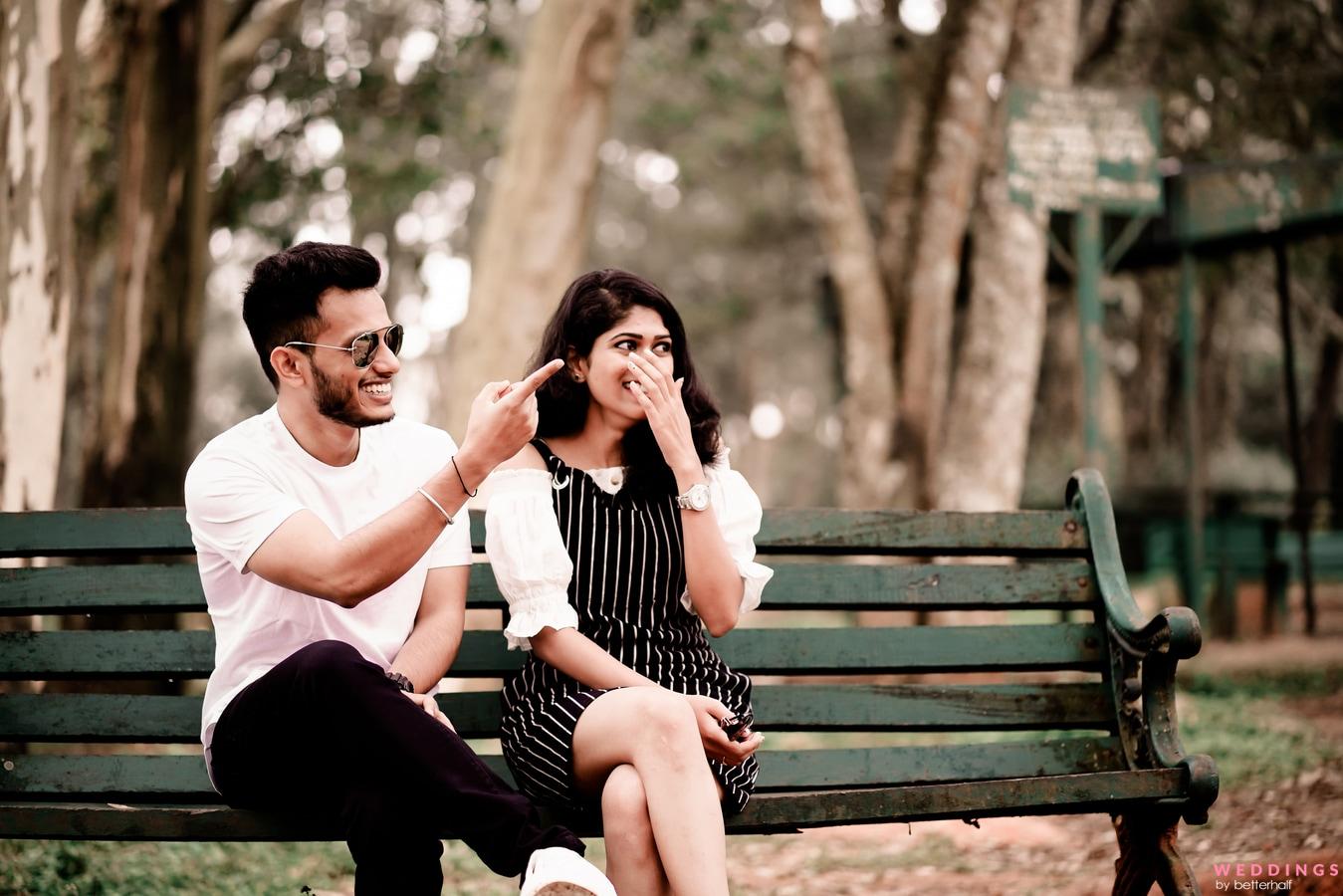 Premium Photo | Loving couple sitting on a bench